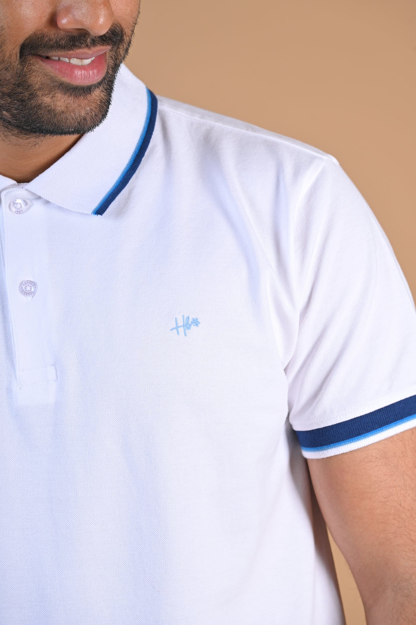 Happy Bay Polo Shirt  Ideal for all your summer adventures in classic white. Order now!